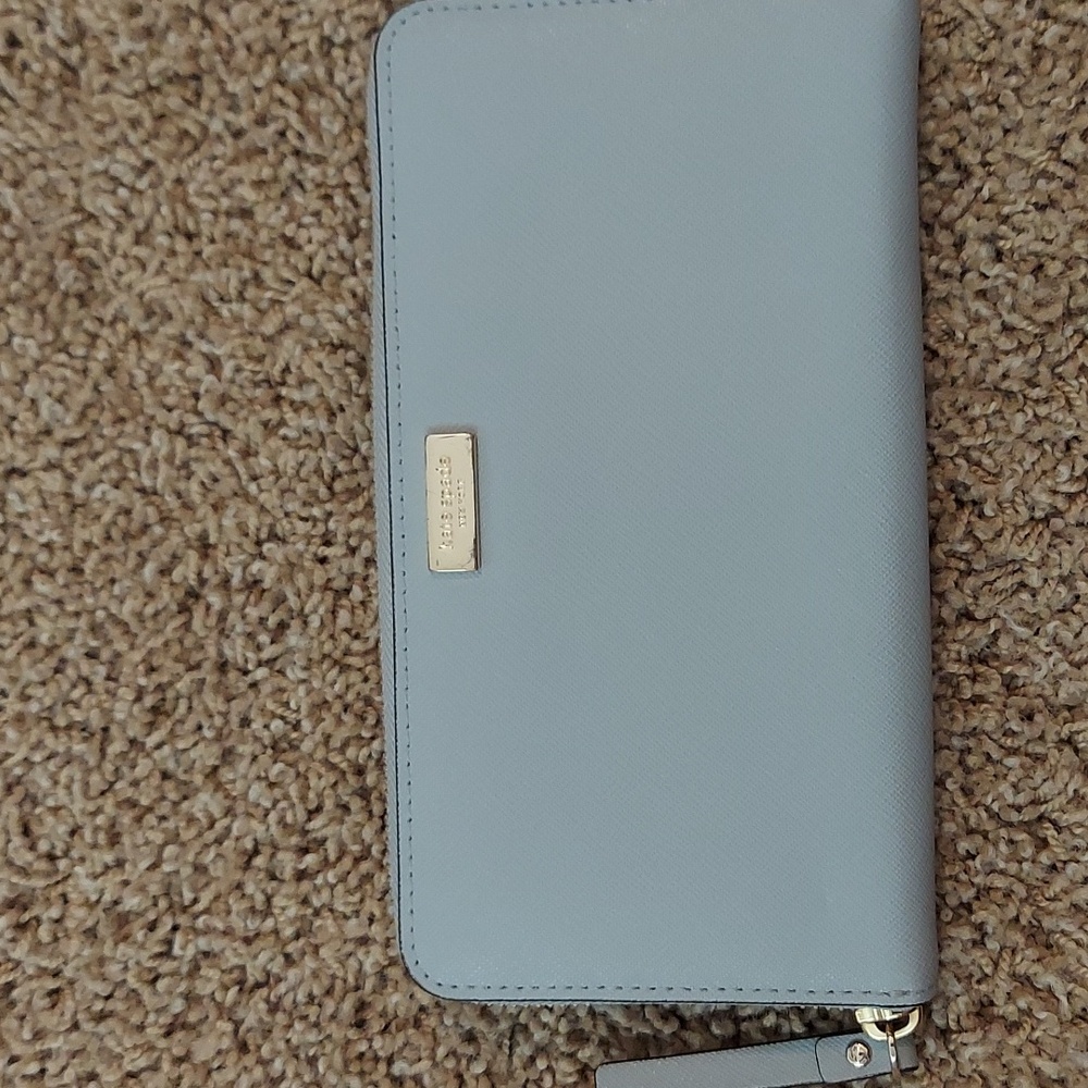 Gray zippered around Kate Spade wallet